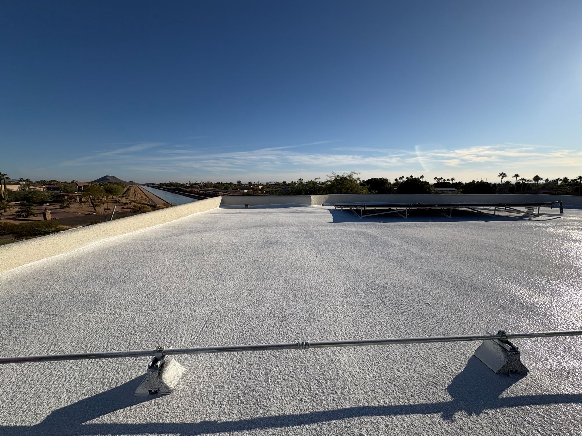 A white roof with a blue sky in the background