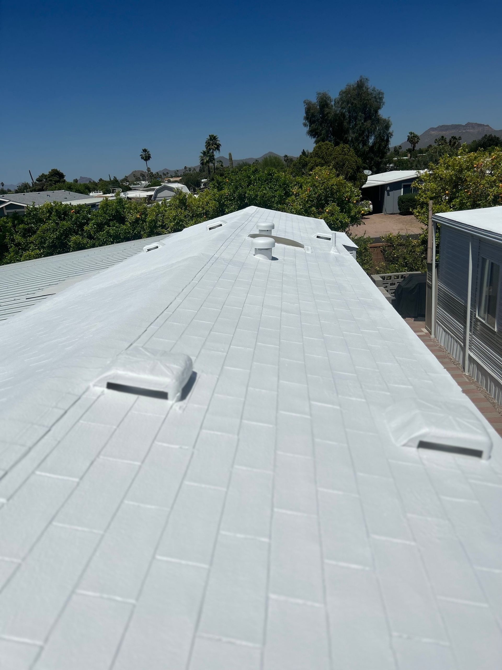 A white roof with a blue sky in the background