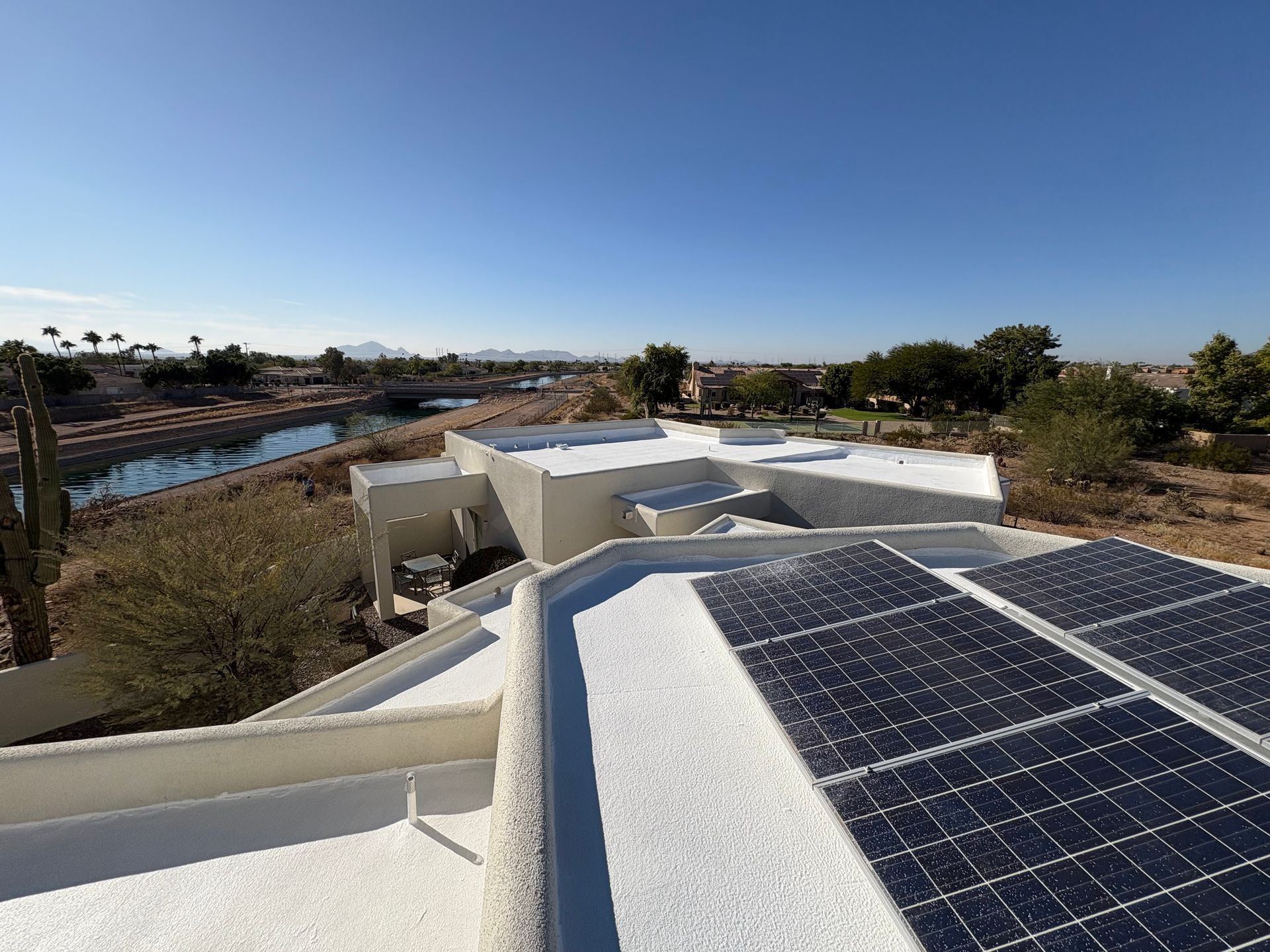 A house with a lot of solar panels on the roof