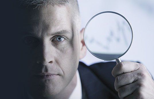 Investigator holding magnifying glass