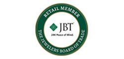 JBT Retail Member logo with green circular seal and central diamond emblem