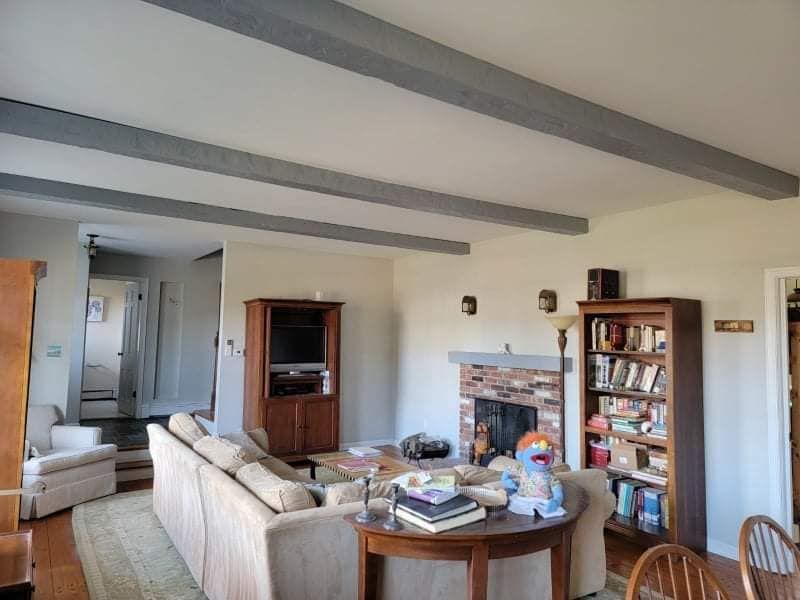 A living room with a fireplace and a couch