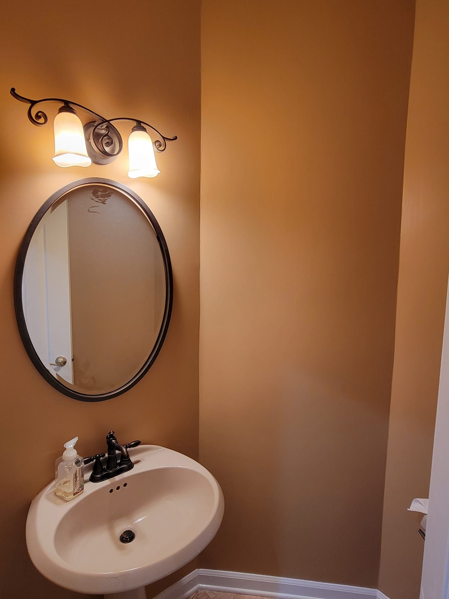 A bathroom with a sink and a mirror