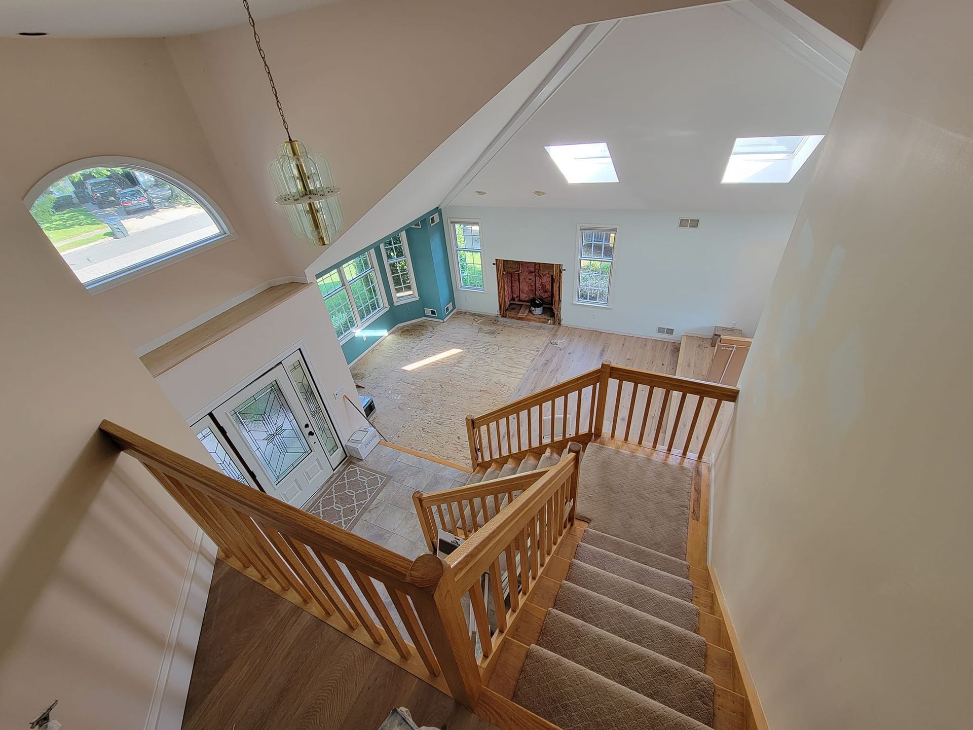 An aerial view of a house with stairs and a fireplace.
