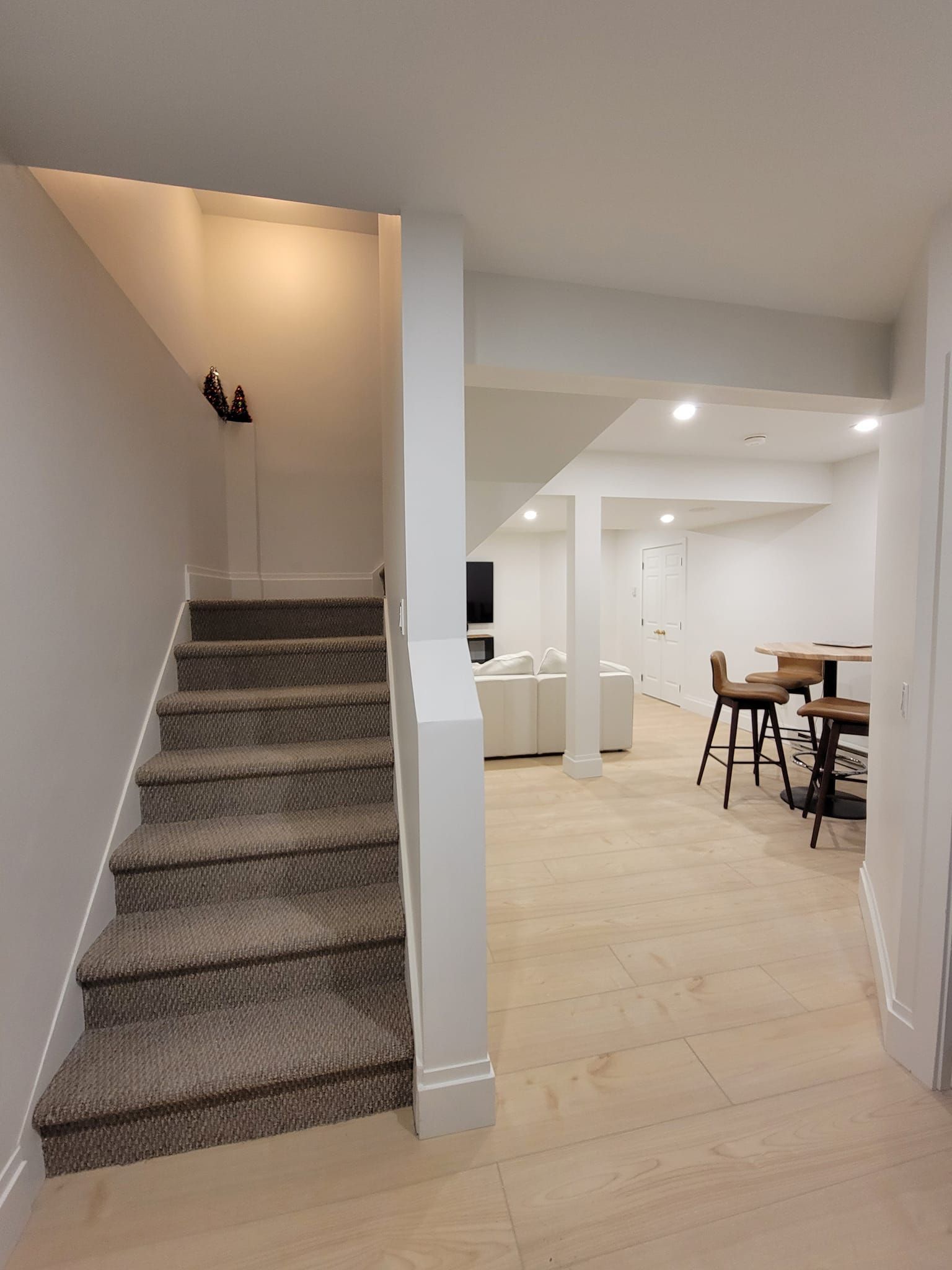 A basement with stairs leading up to the second floor