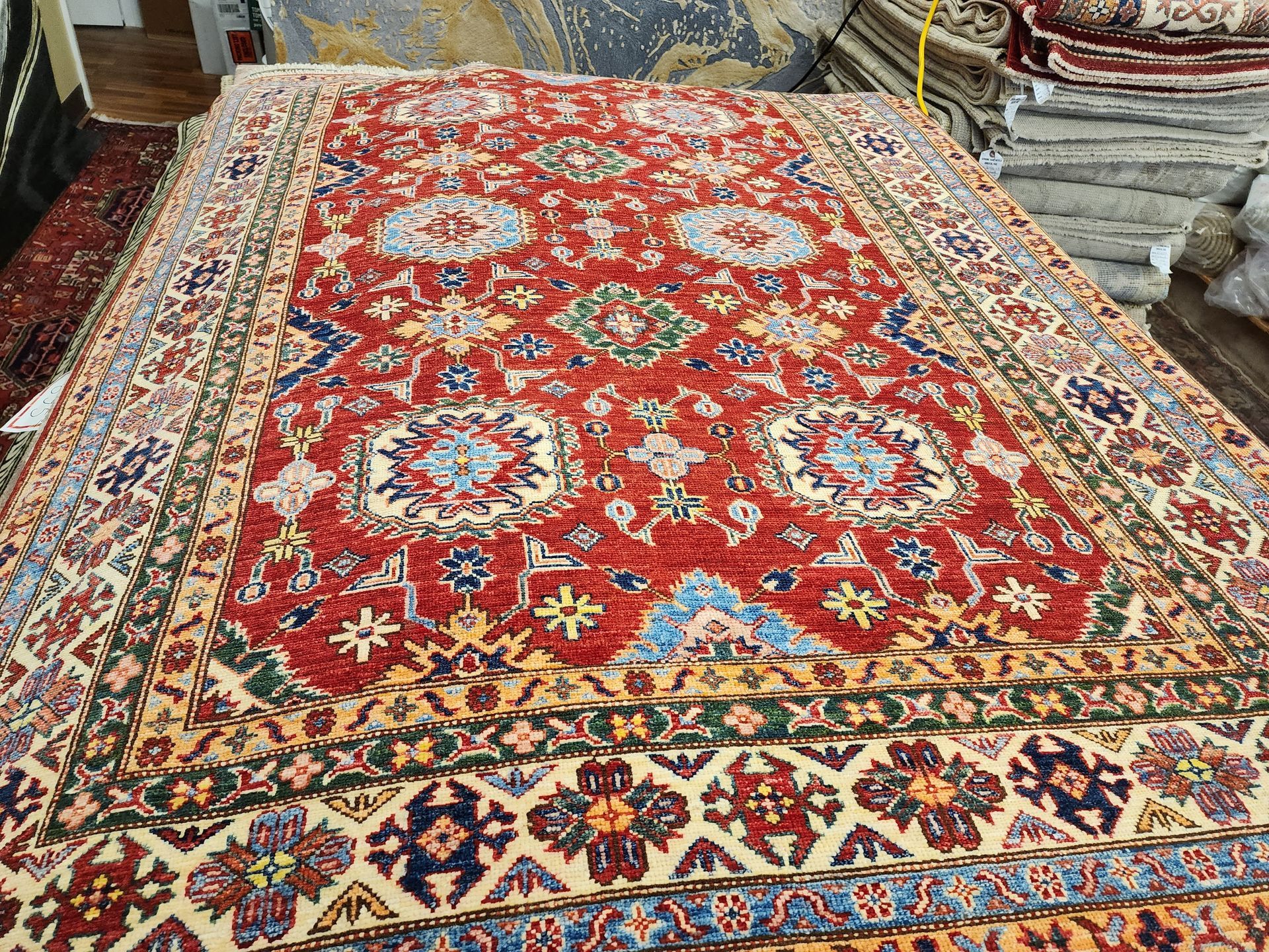 A large rug is sitting on top of a wooden table.