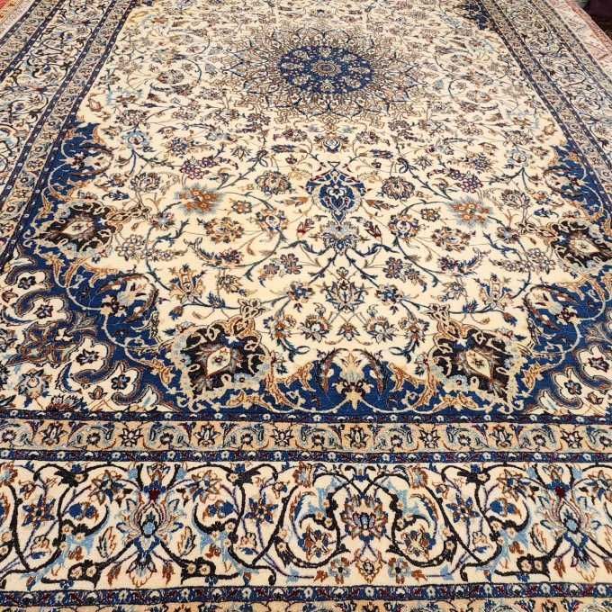 A rug with a blue and white pattern is sitting on a table.