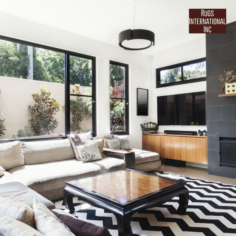 A living room with a sign that says rugs international inc.