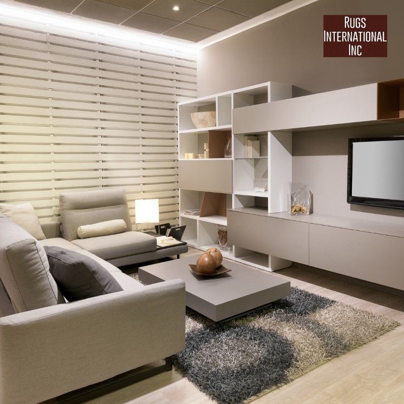 A living room with a sign that says rugs international inc.