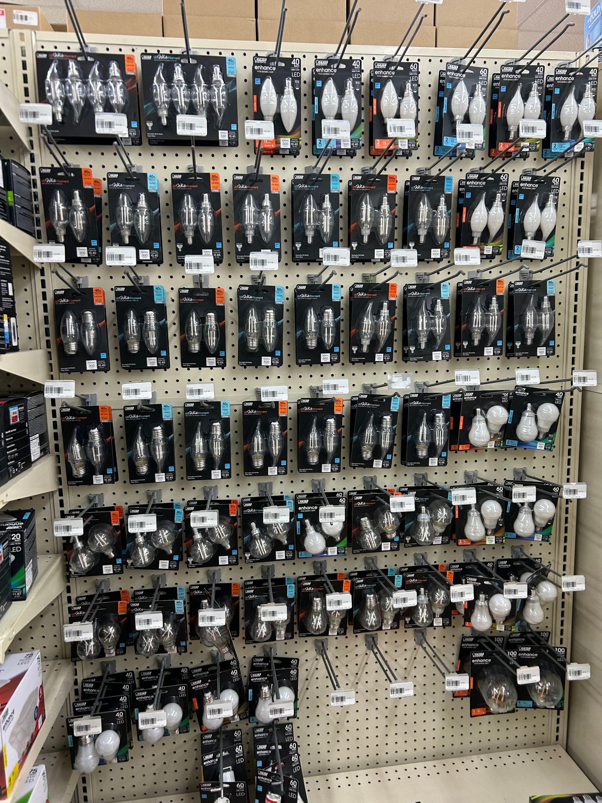 A wall filled with lots of different types of light bulbs