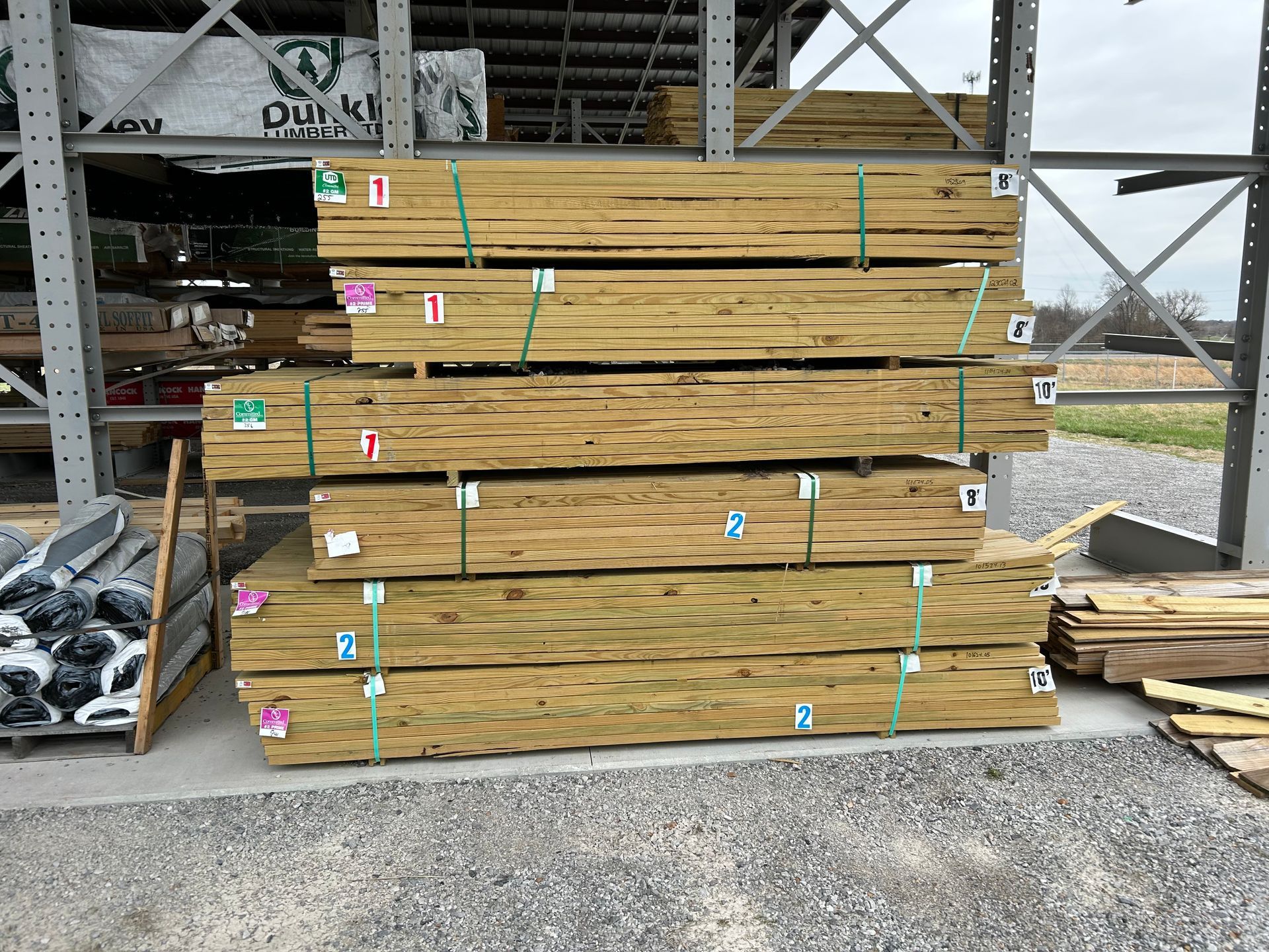 A pile of wood is stacked on top of each other in a warehouse.