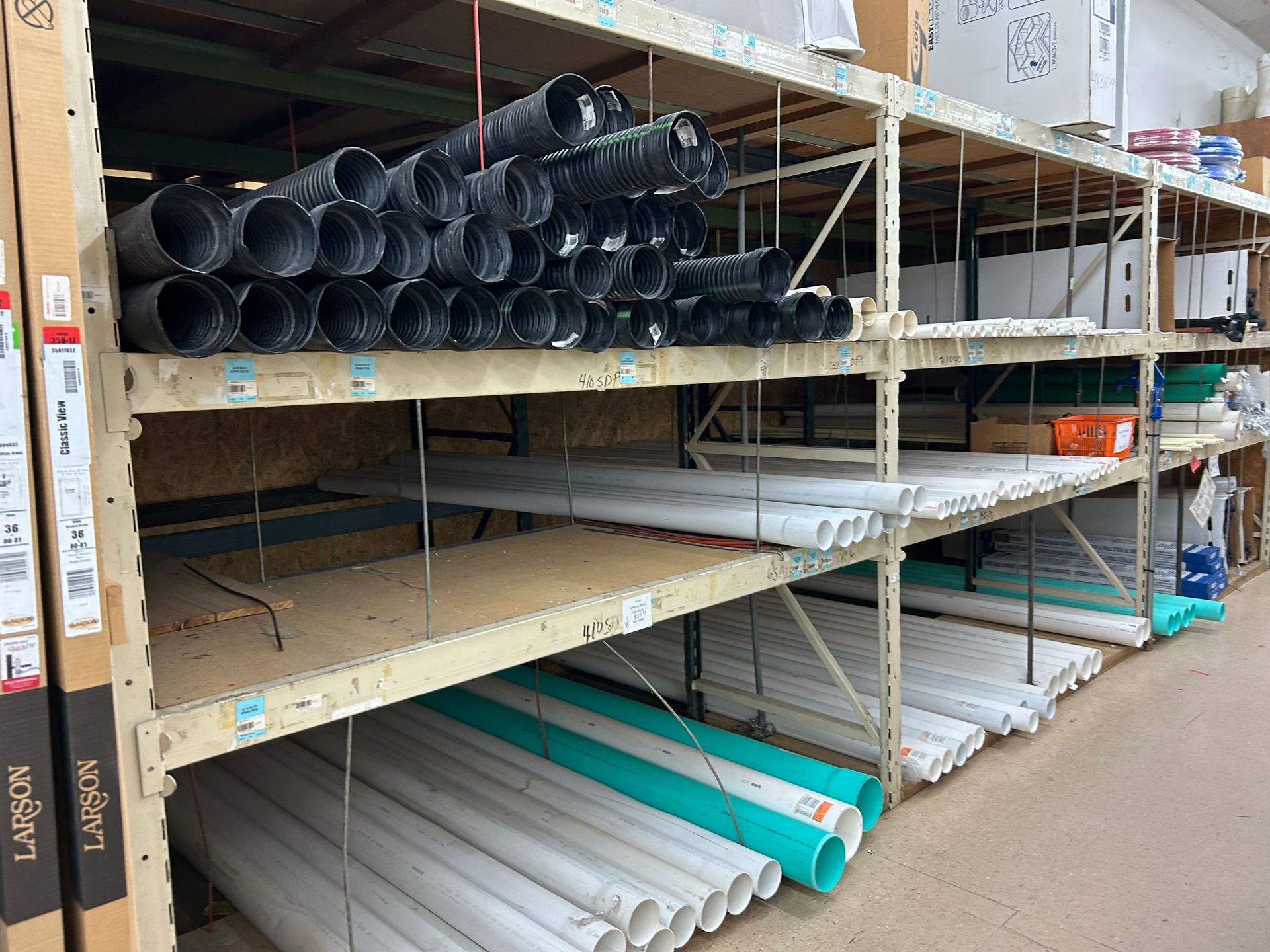 A warehouse filled with lots of pipes and boxes.