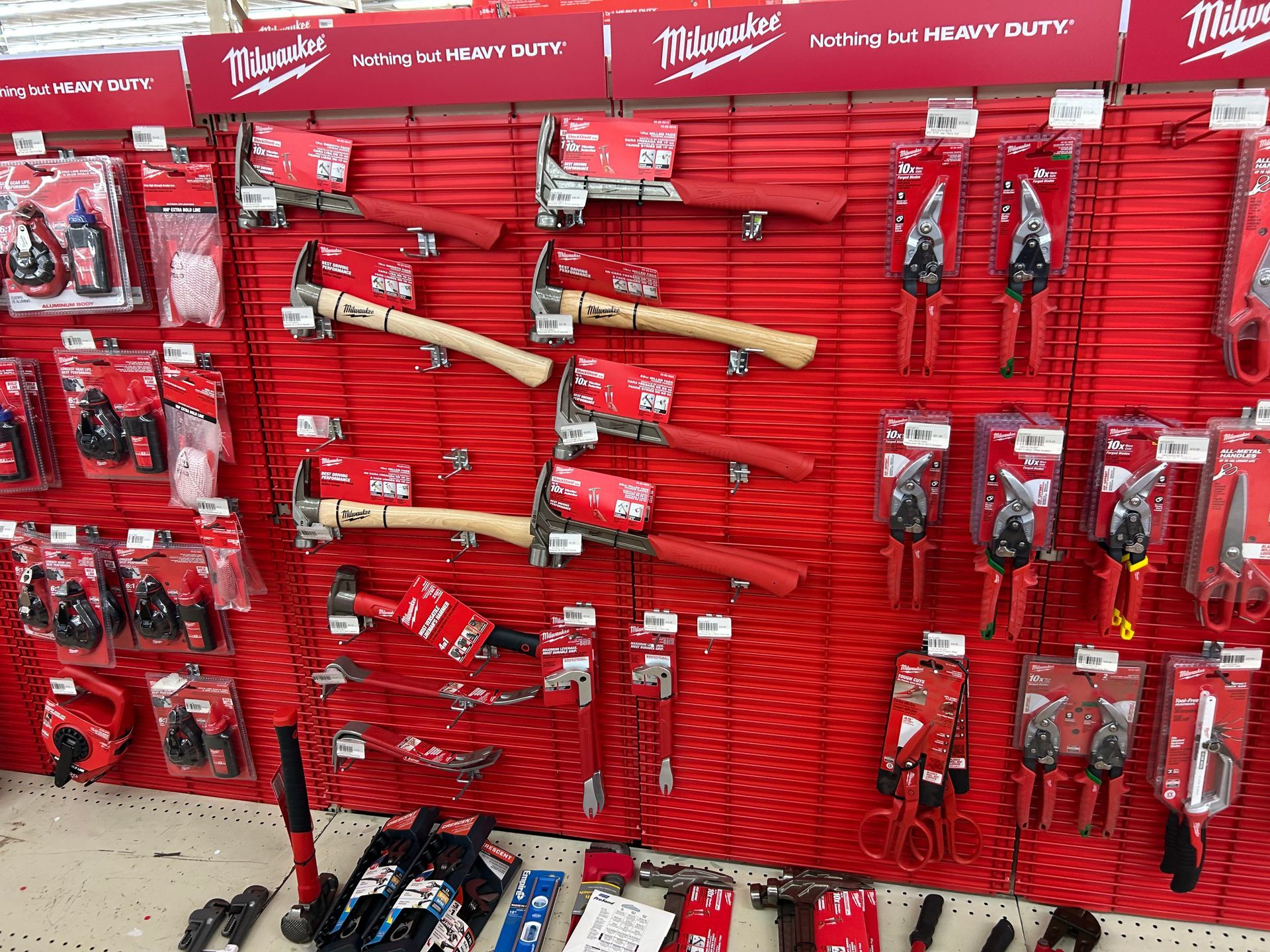 A wall with a bunch of tools hanging on it