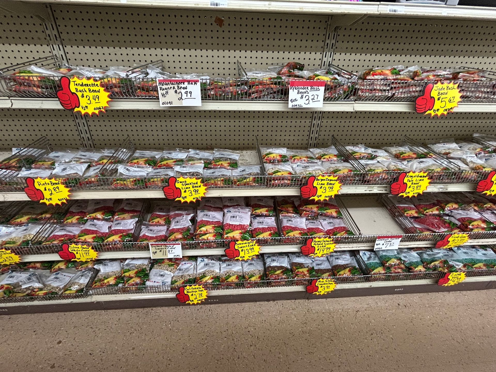 A grocery store aisle filled with lots of frozen food