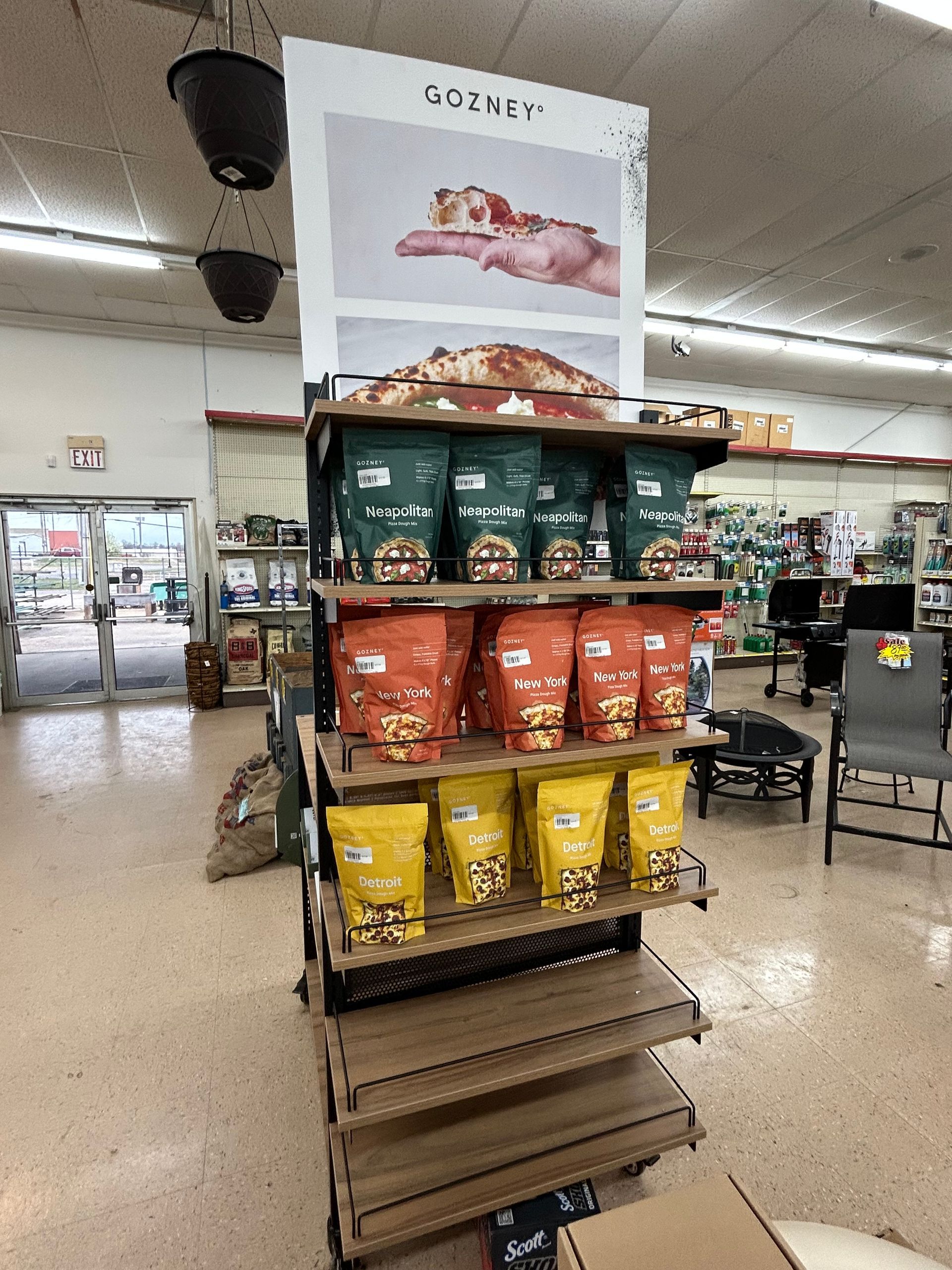 A display of bags of dog food in a store.