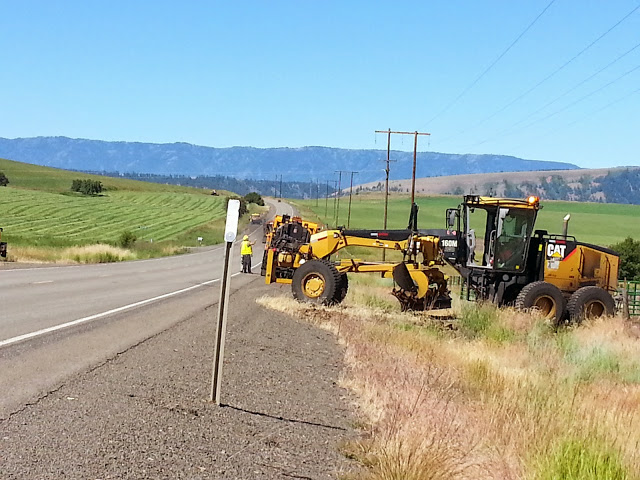 Excavators along roadside