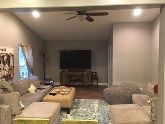 A living room filled with furniture and a flat screen tv.