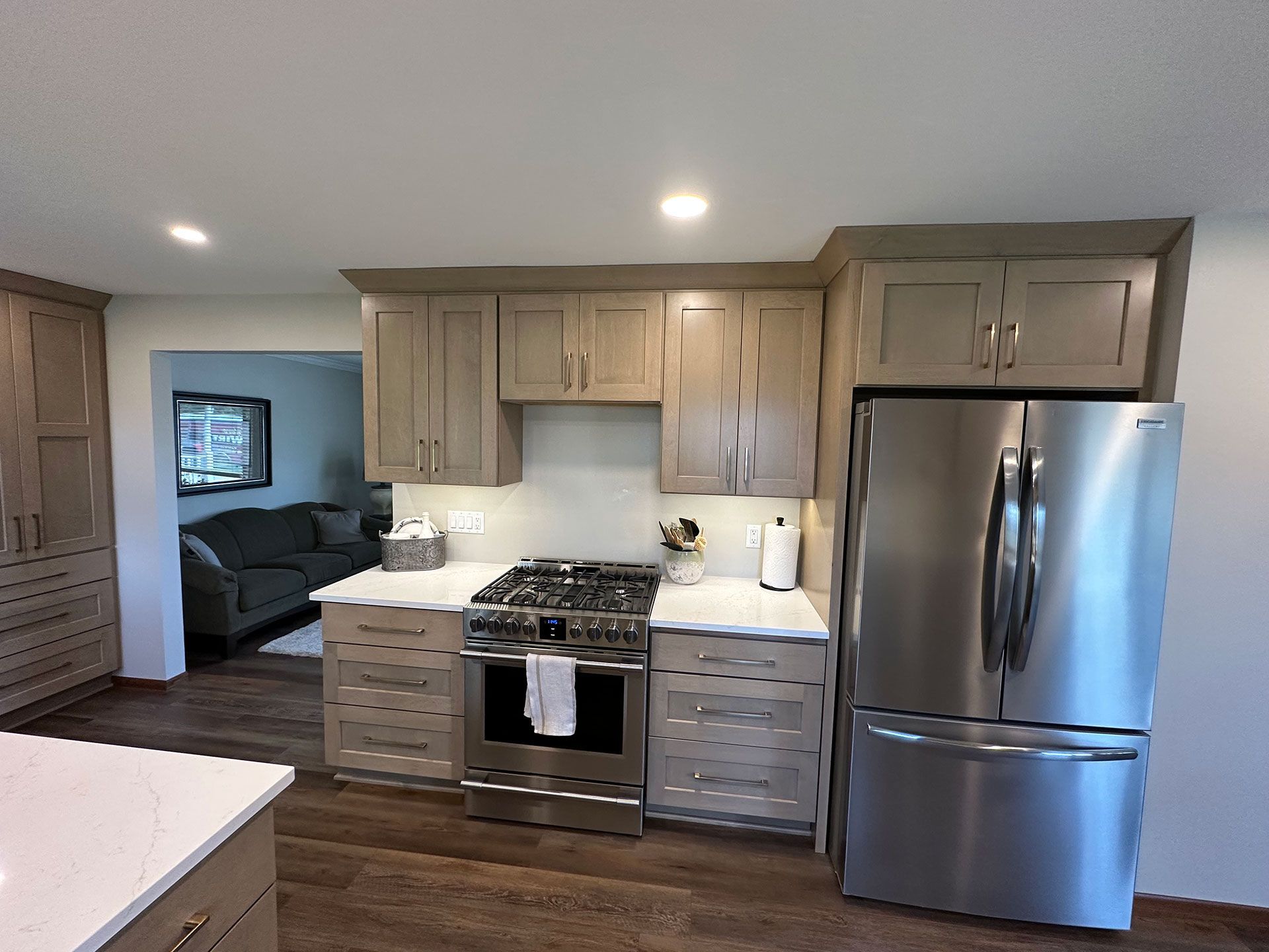 A kitchen with wood flooring.