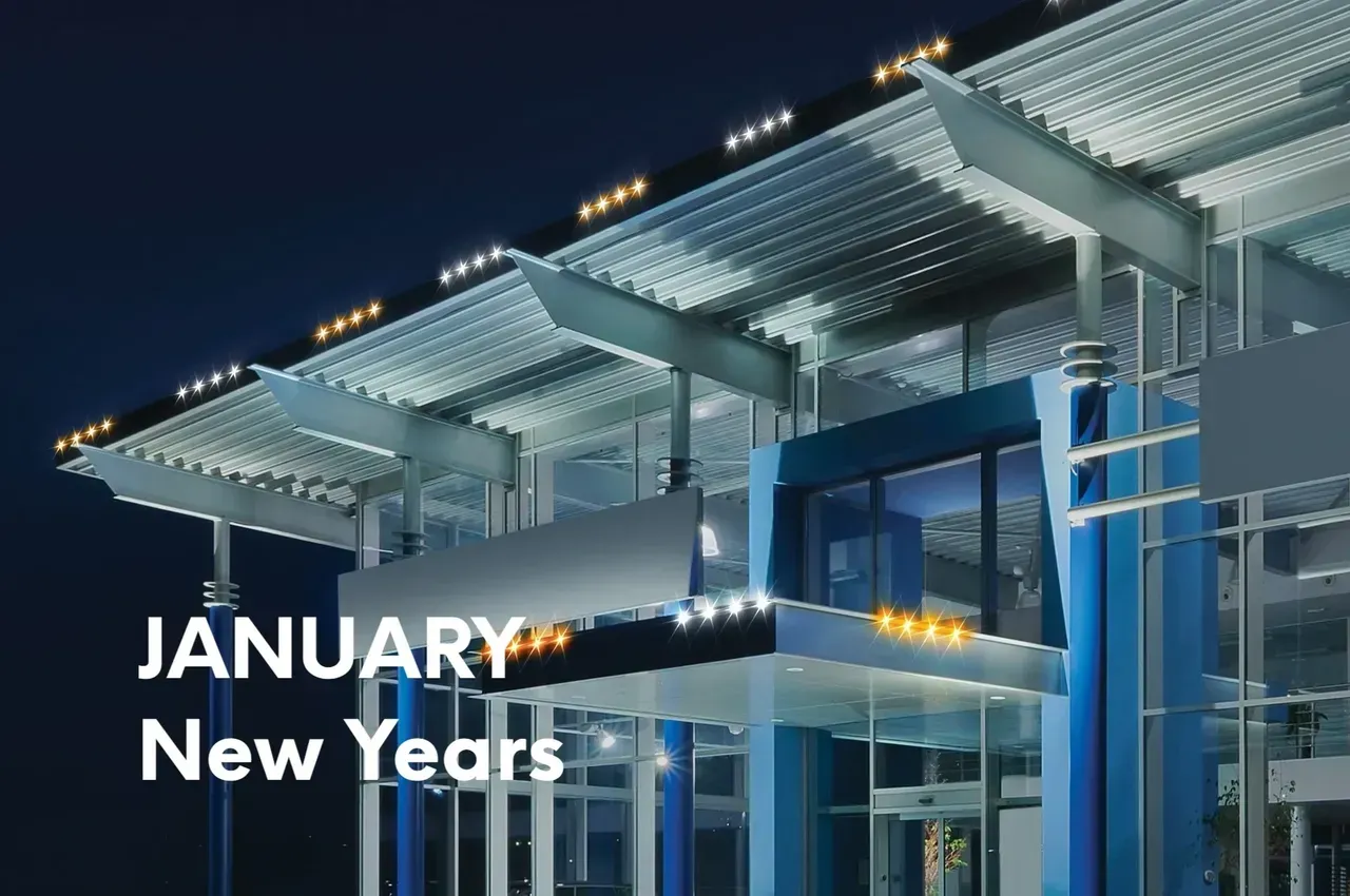 Modern building facade lit at night with 