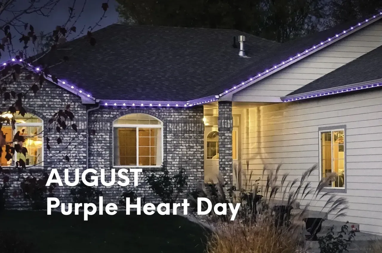 House with purple lights for August Purple Heart Day.