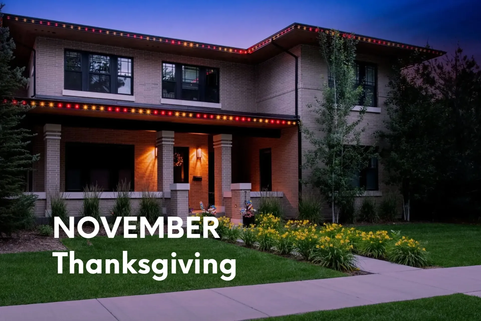 House with red and yellow lights decorated for November and Thanksgiving.