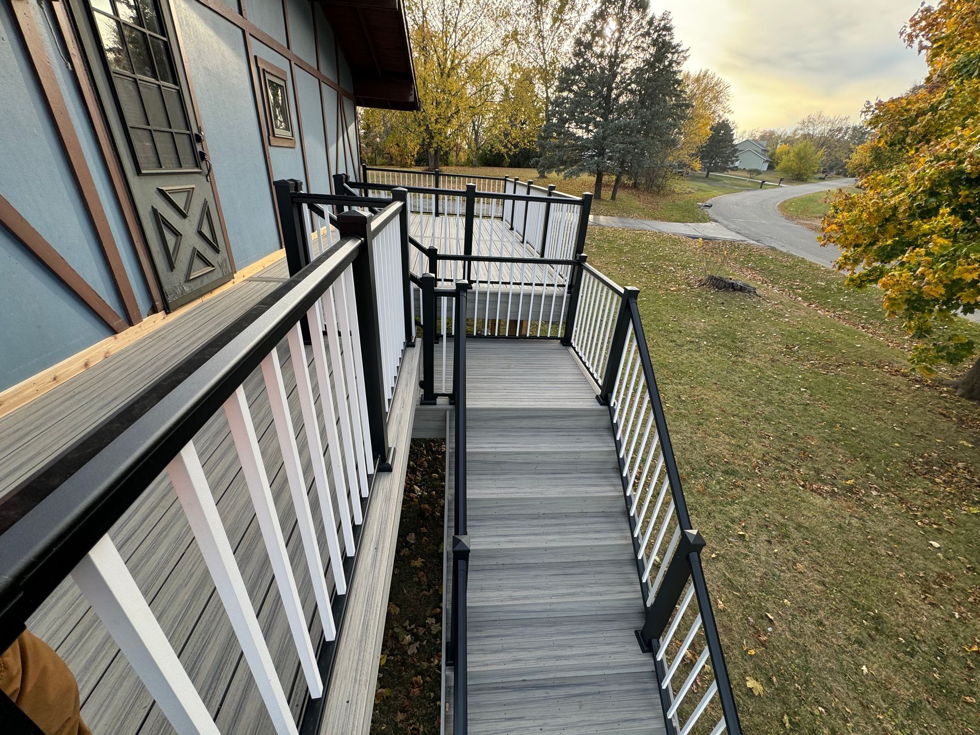 A wooden deck with stairs leading up to it