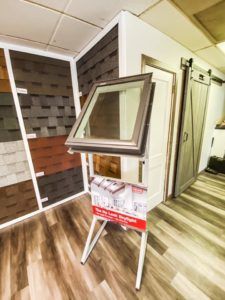 A window display in a room with a wooden floor.