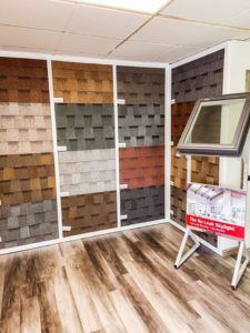 There are many different types of shingles on the wall in this room.