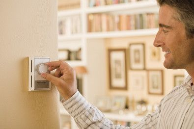 Man adjusting the temperature.