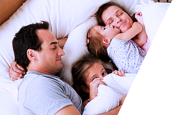 Happy family on the bed