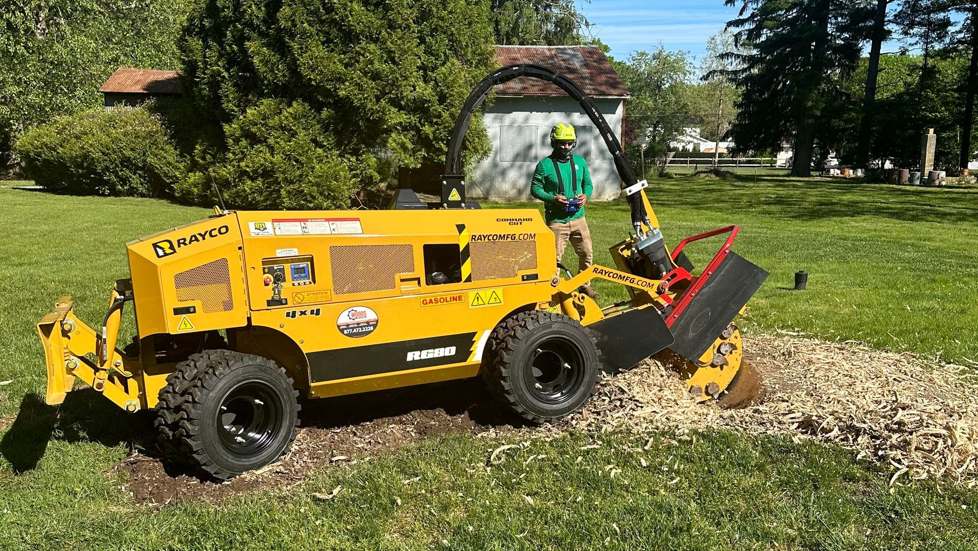 A stump grinder is sitting on top of a pile of wood chips.