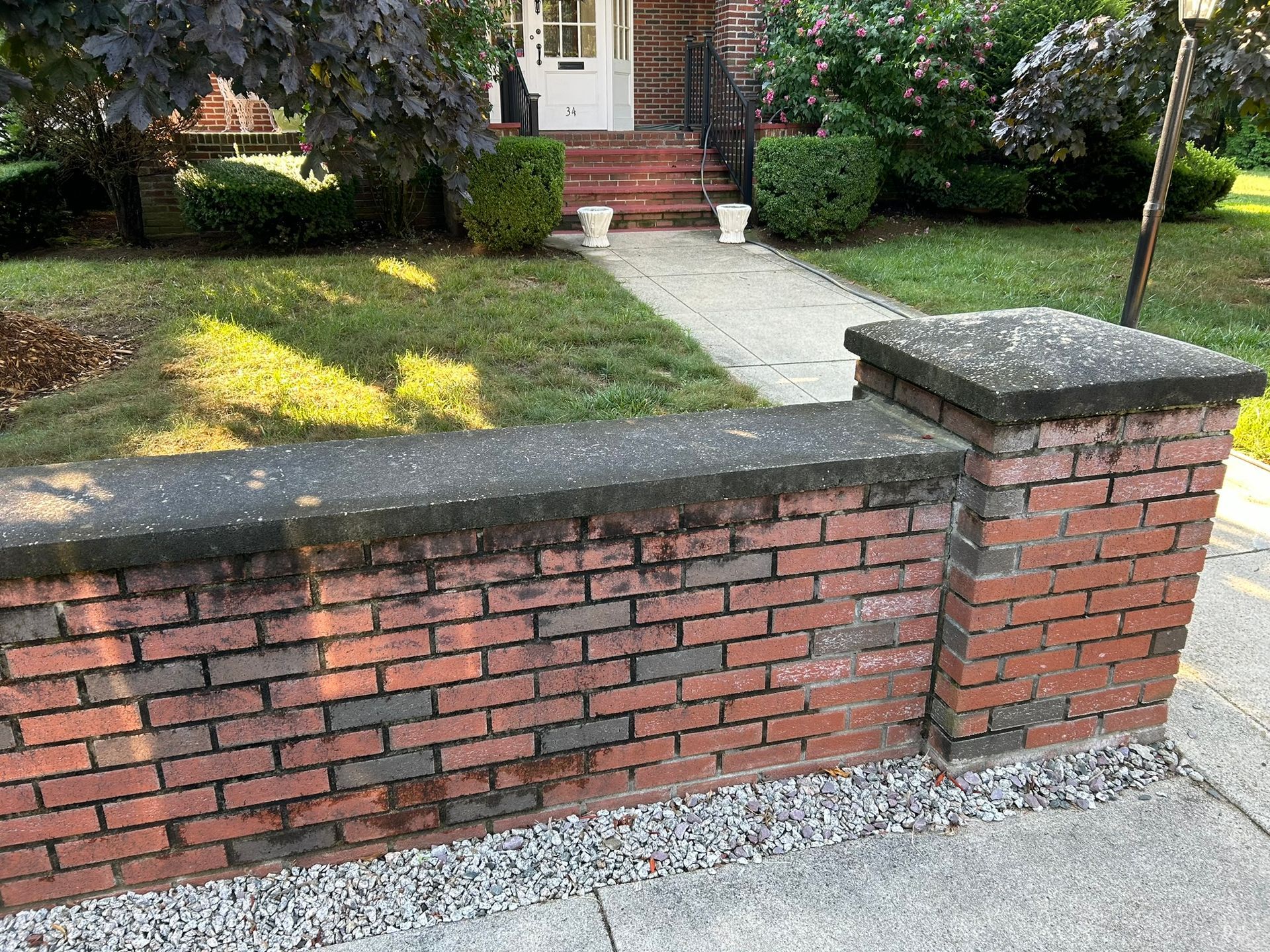 brick wall in front of a house -before