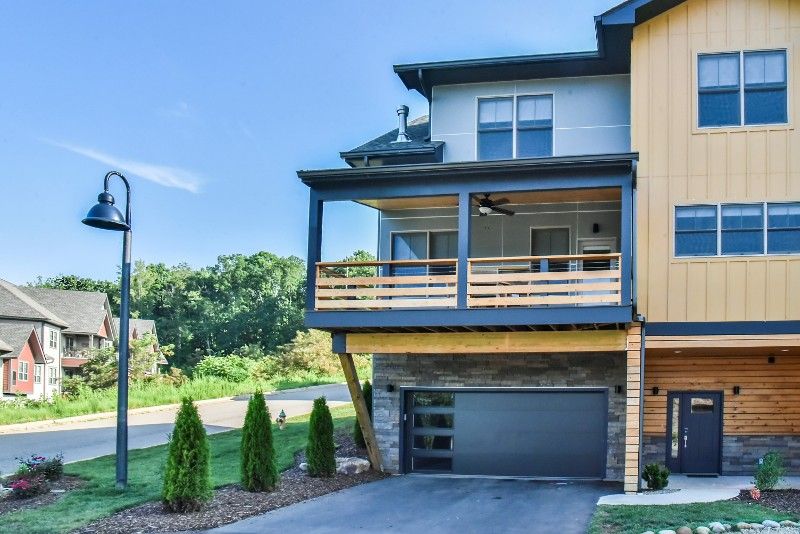 A large house with a large garage and a balcony.