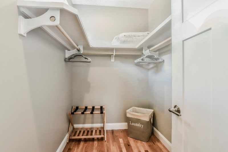 There is a laundry basket in the closet.