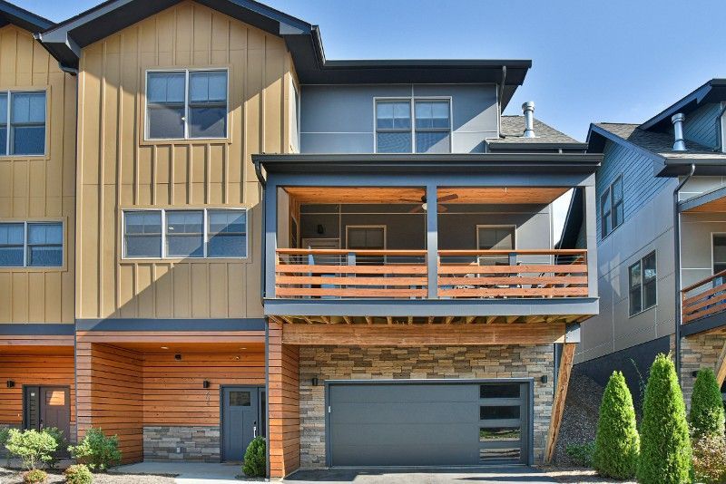A large house with a balcony and a garage.