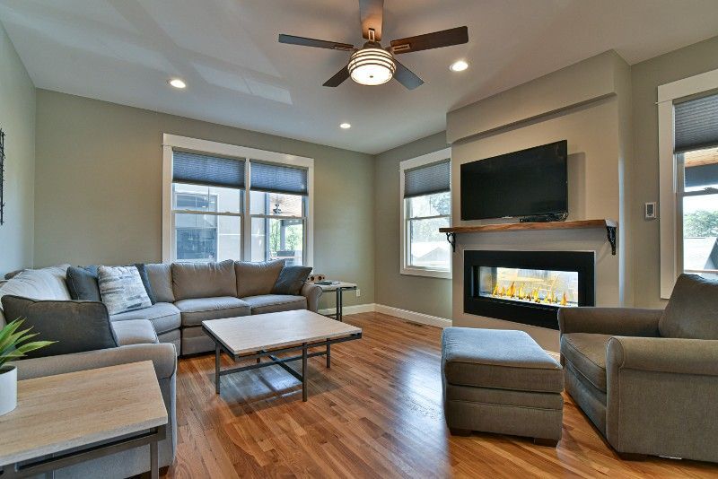A living room filled with furniture and a fireplace.