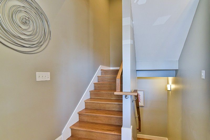 A wooden staircase leading up to the second floor of a house.