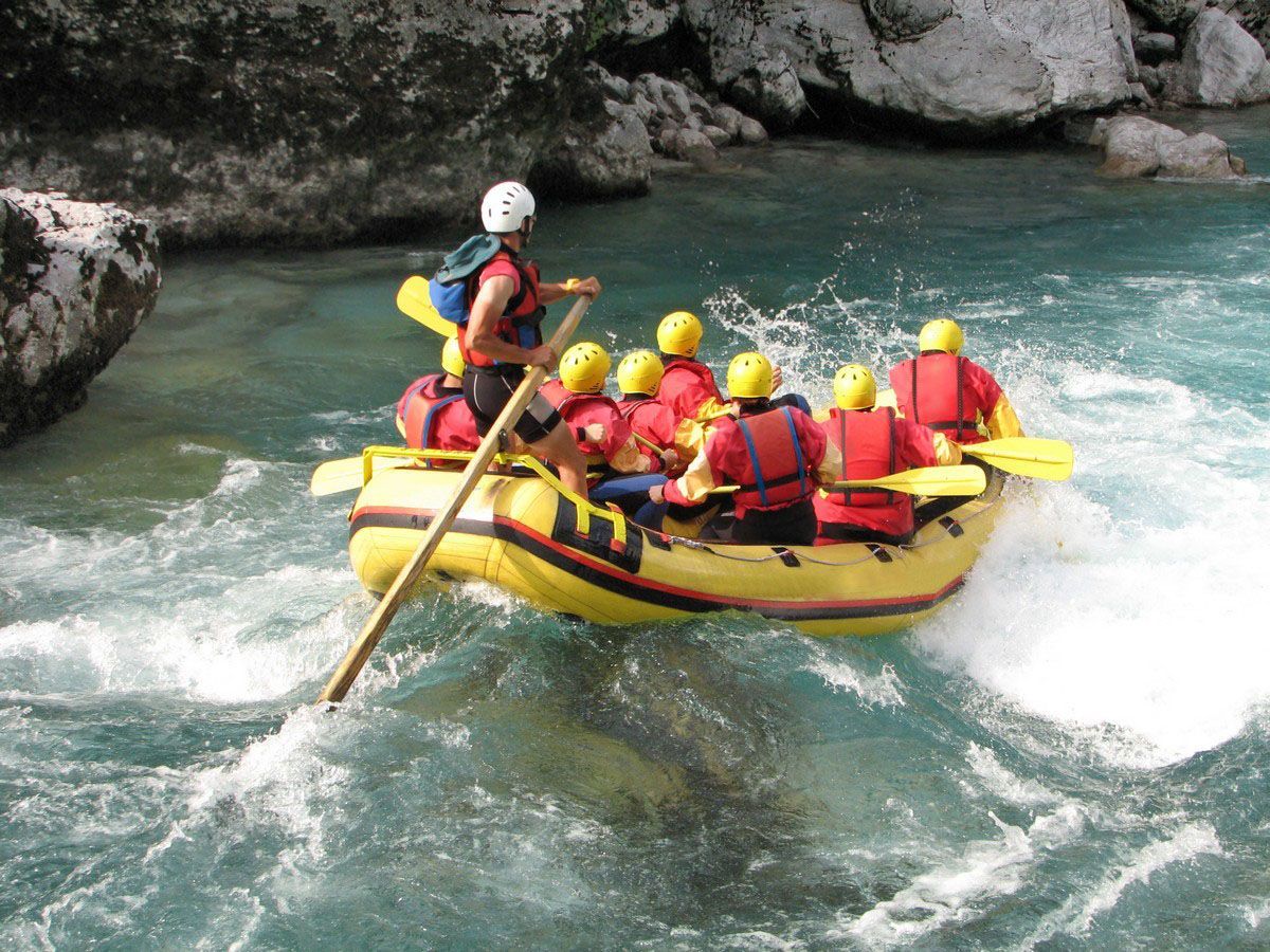 A group of people are rafting down a river