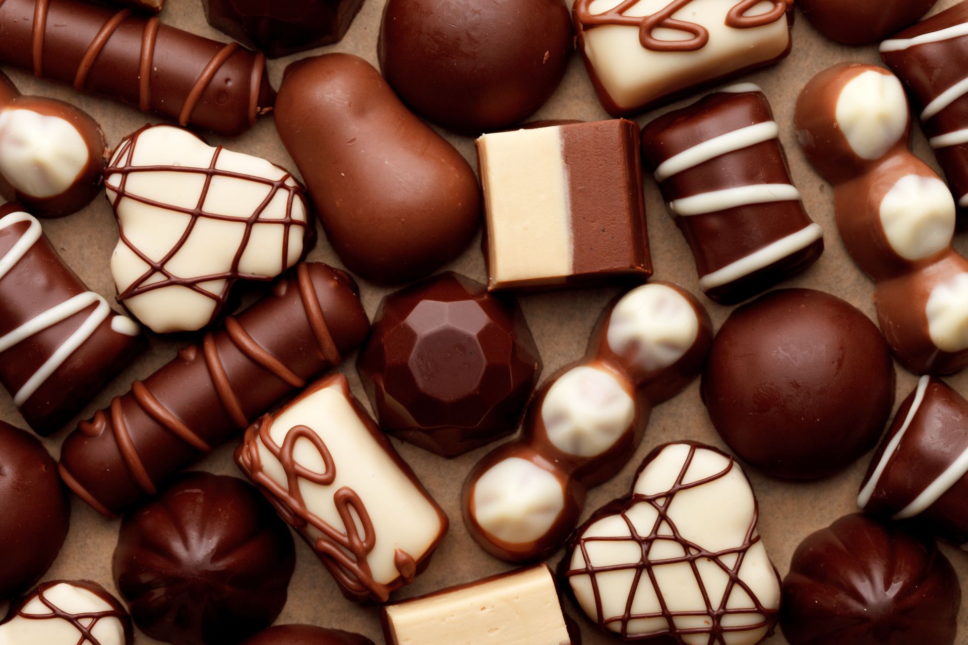 A variety of chocolates are sitting on a table