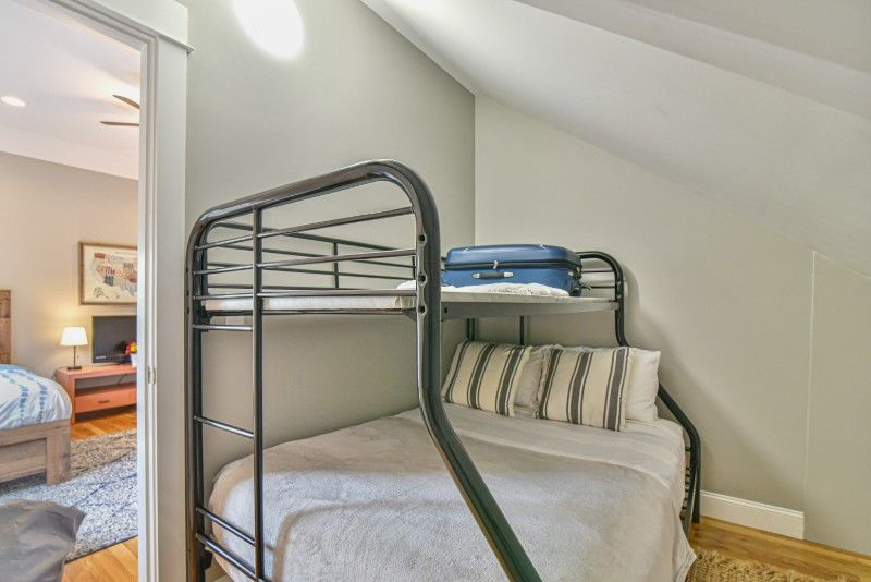 There is a bunk bed in the corner of the room.