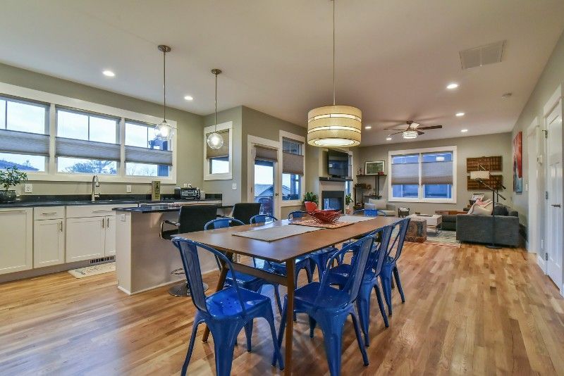 There is a dining table and chairs in the middle of the room.