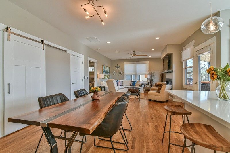 There is a large wooden table in the middle of the room.
