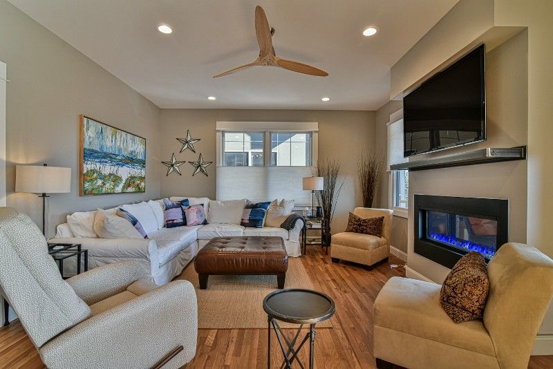 A living room filled with furniture and a fireplace.