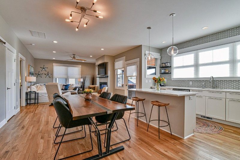 There is a dining table and chairs in the middle of the room.