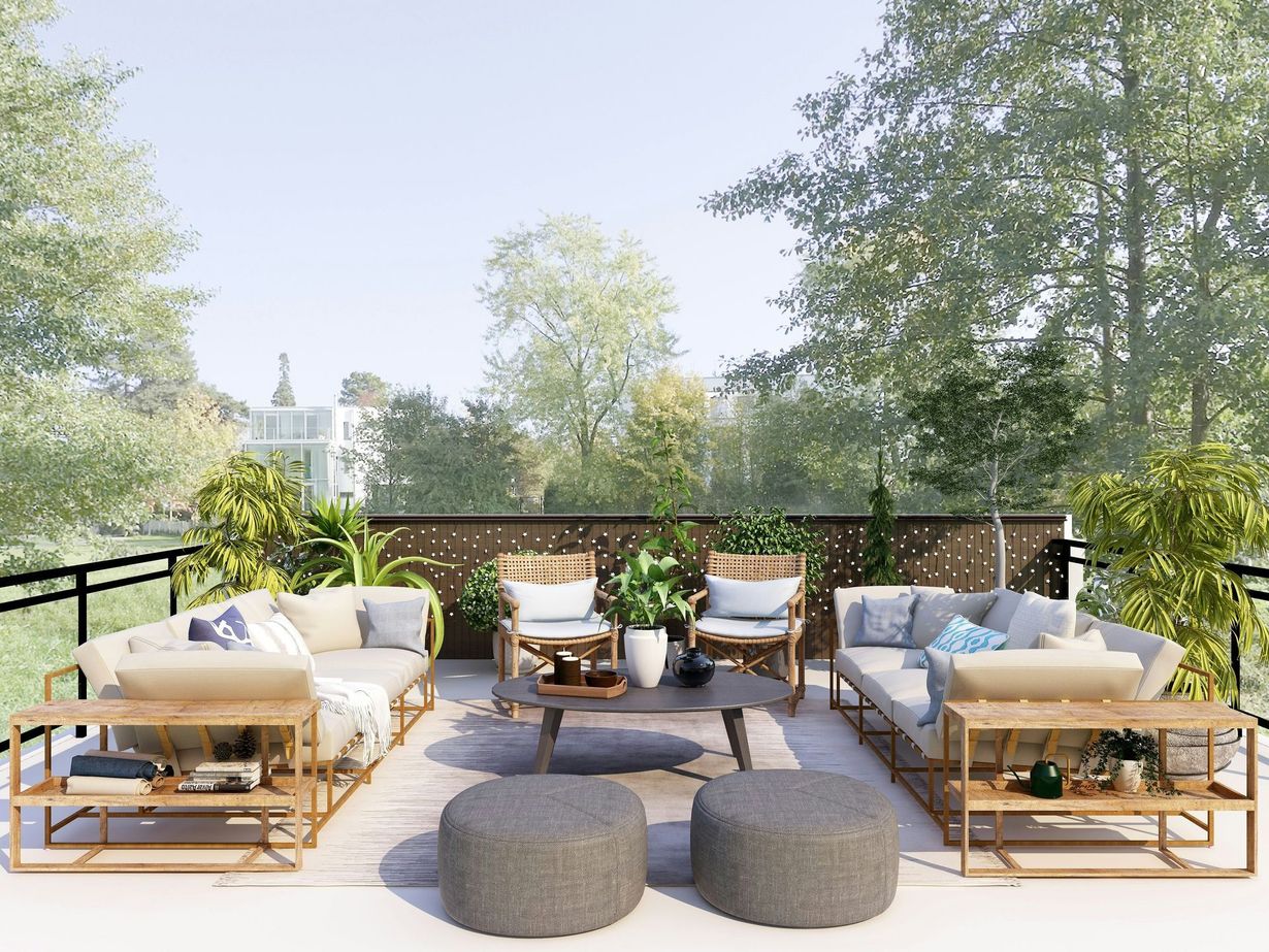 Sunset view of a screened patio with lounge chairs beside a swimming pool and palm trees