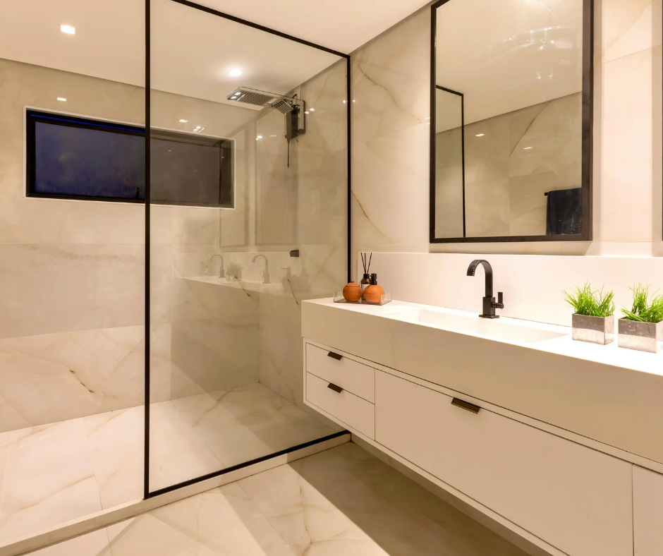 Modern beige bathroom with glass shower, floating vanity, black fixtures, and wall mirror