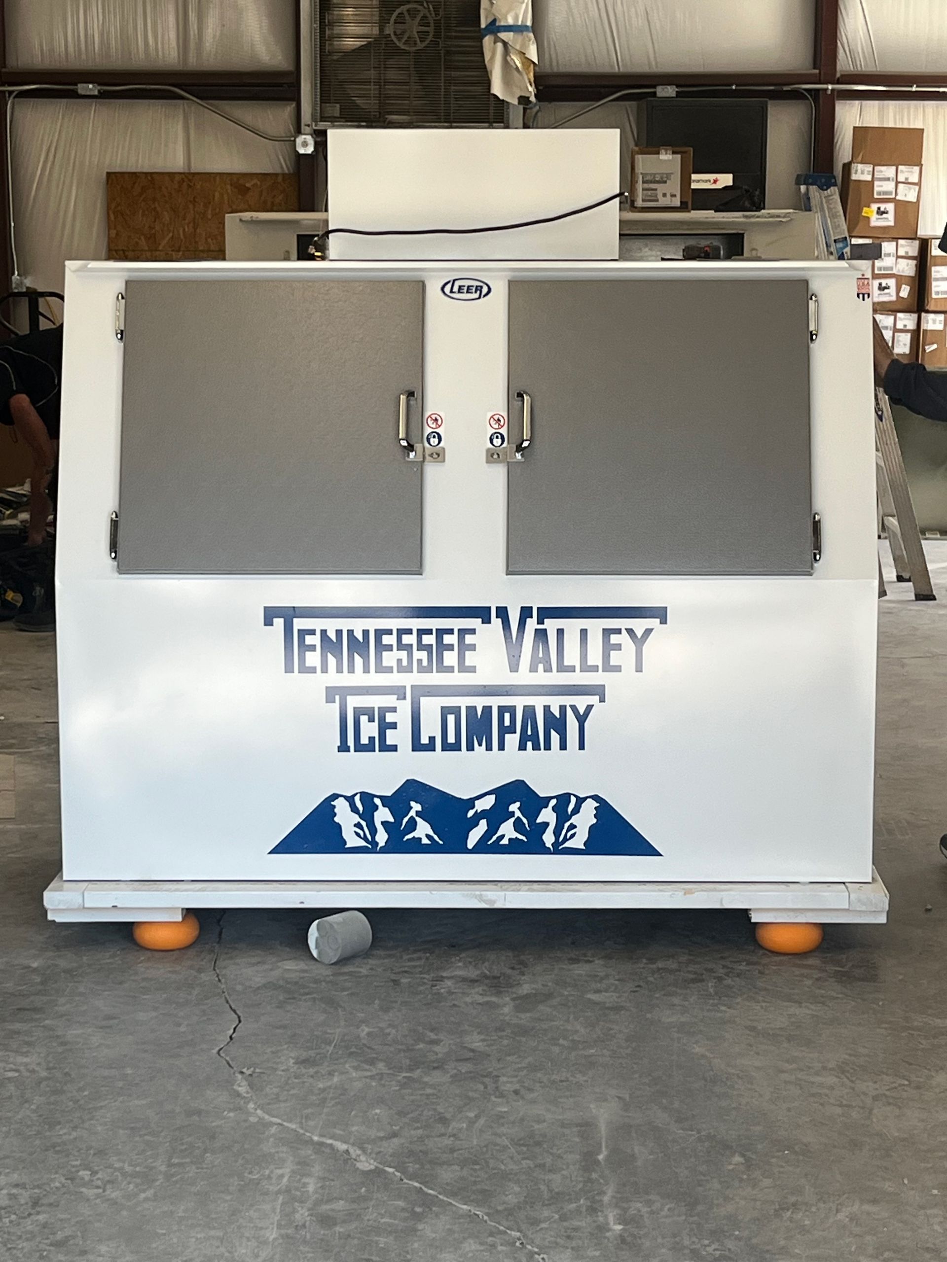 White ice machine with gray doors, 