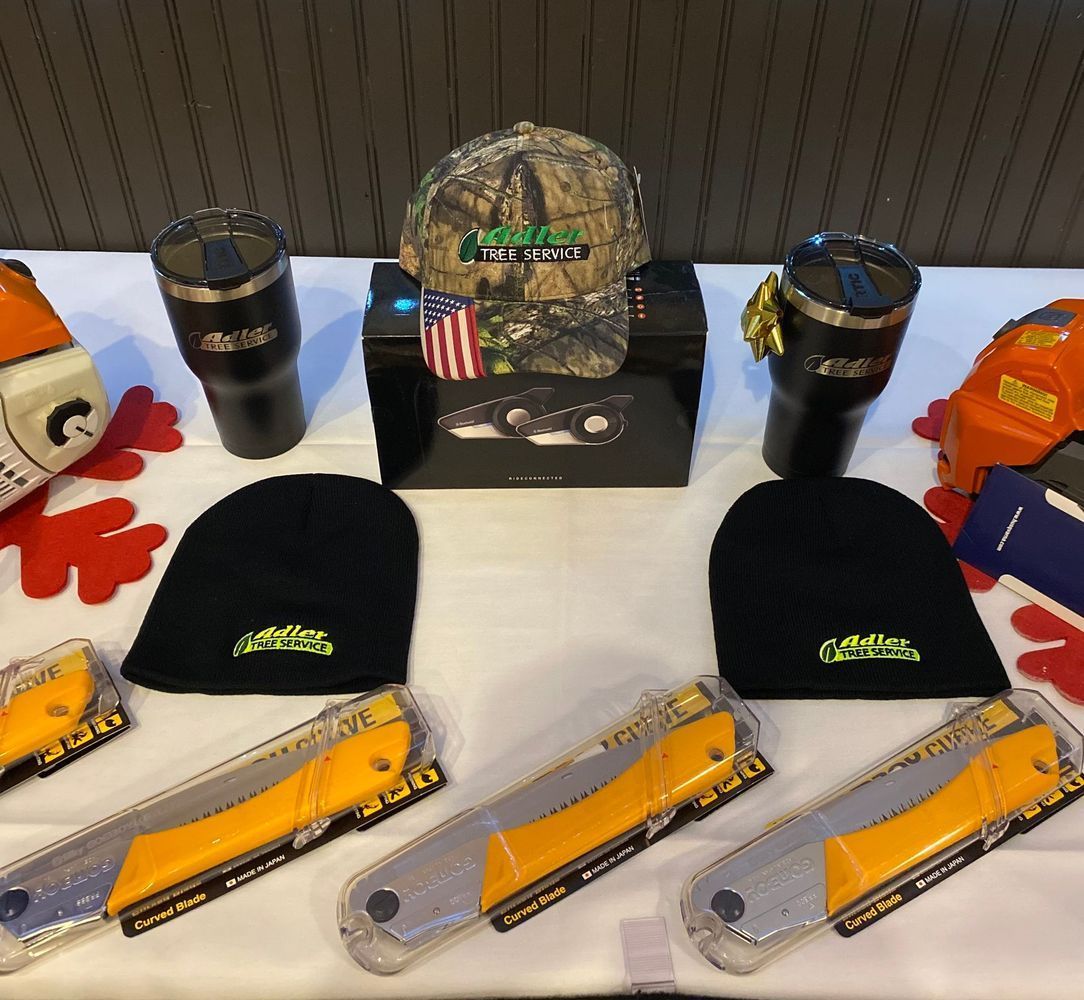 A table filled with a variety of items including hats and knives