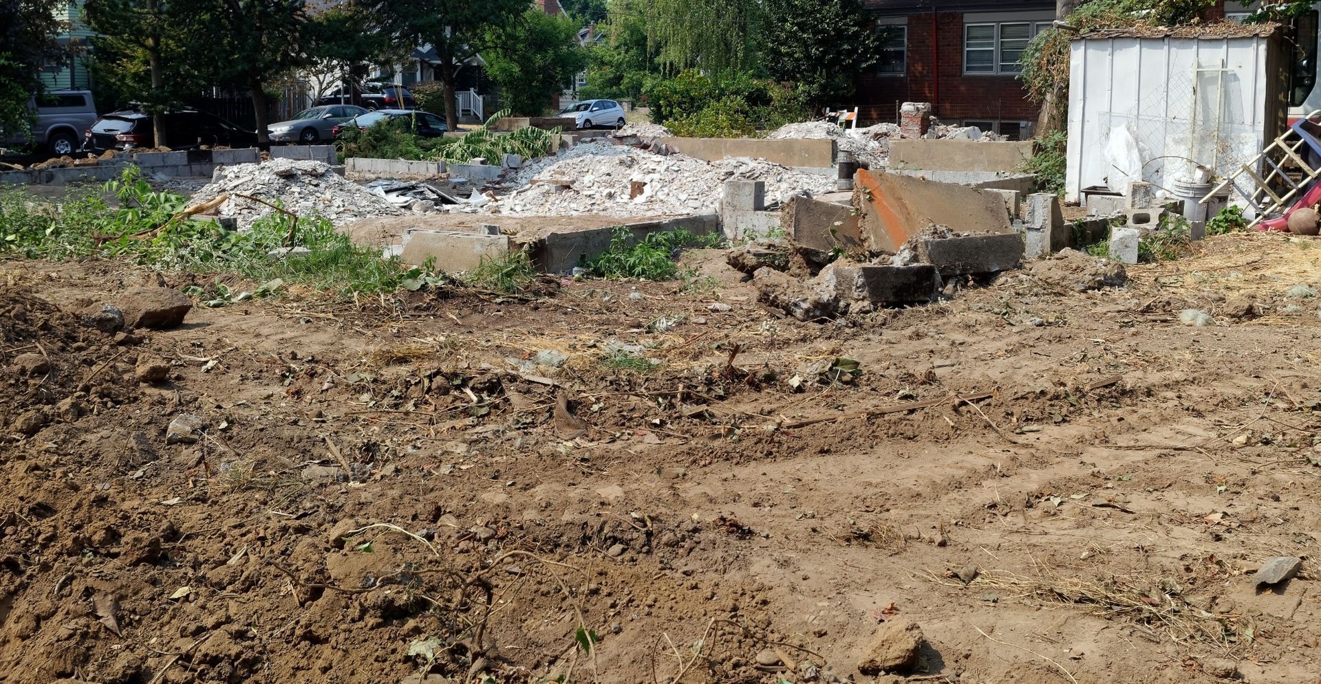 A large pile of dirt is sitting in the middle of a dirt field.