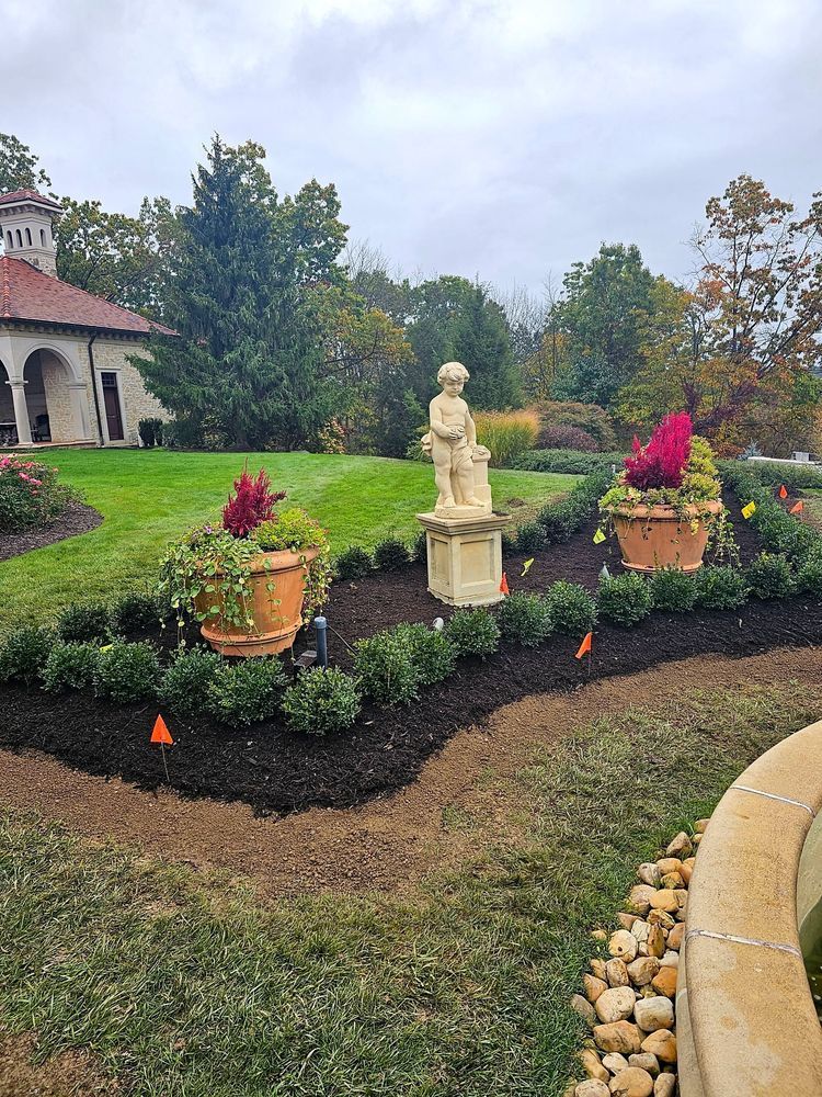 There is a statue in the middle of the garden.